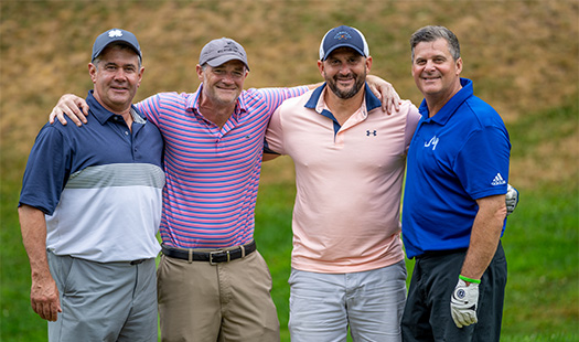 Golfers smiling at camera