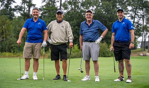 Golfers smiling at camera