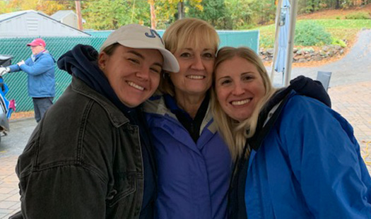 Volunteers smiling at camera