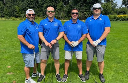 golfers smiling at camera